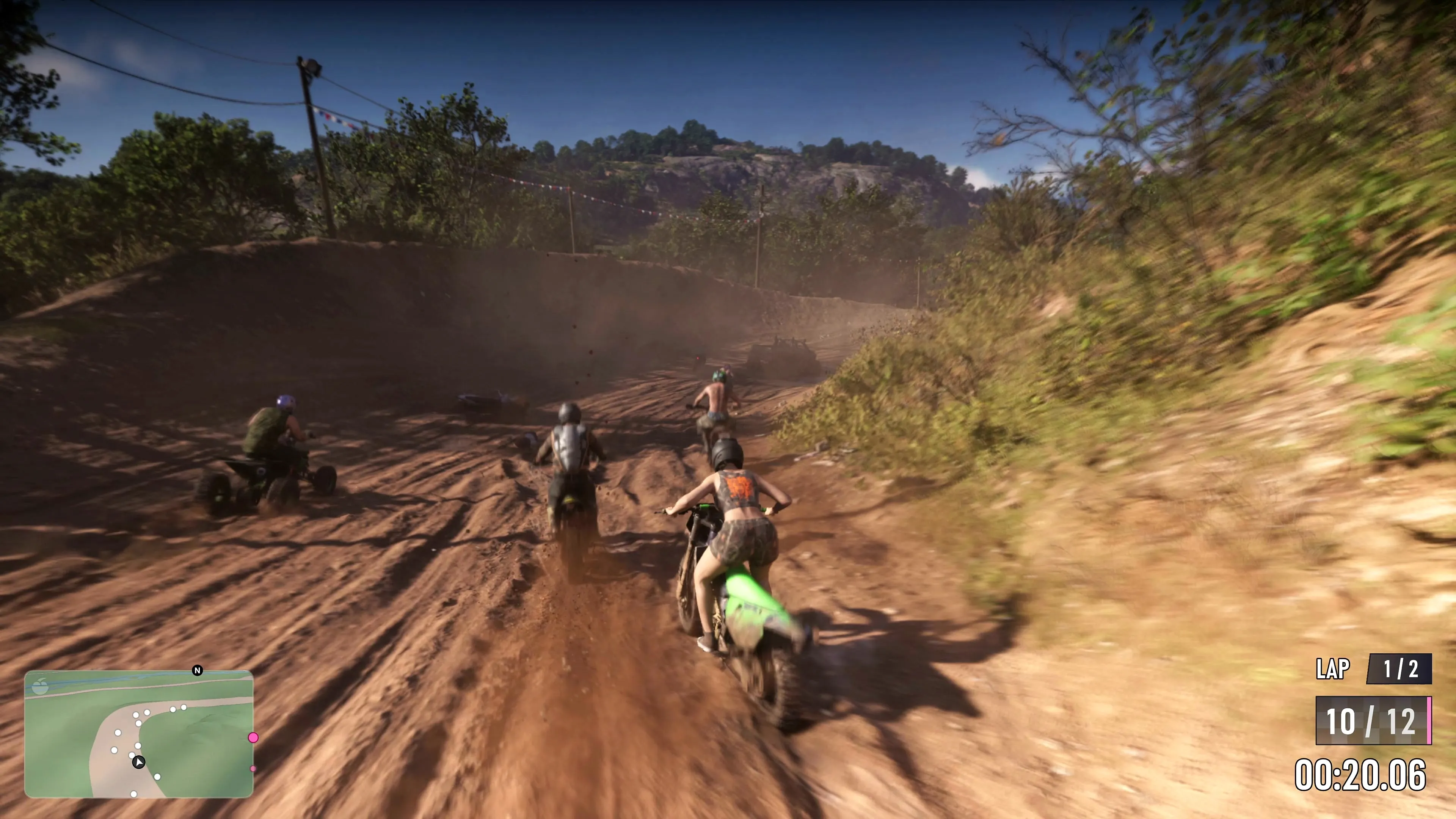 Riders on dirt bikes and quads kicking up dust on a backwoods trail in GTA 6